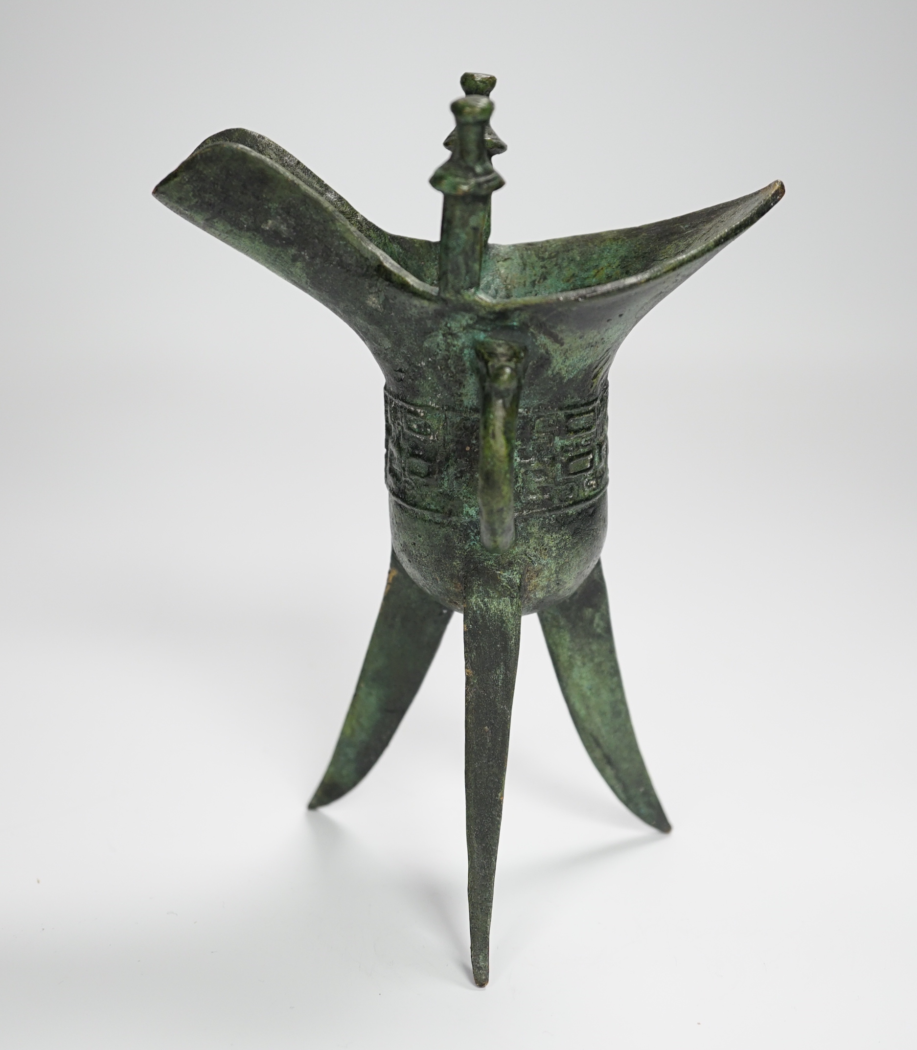 A Chinese bronze archaistic tripod Jue cup (ex. late prof. R.M. Hicks OBE), 18cm